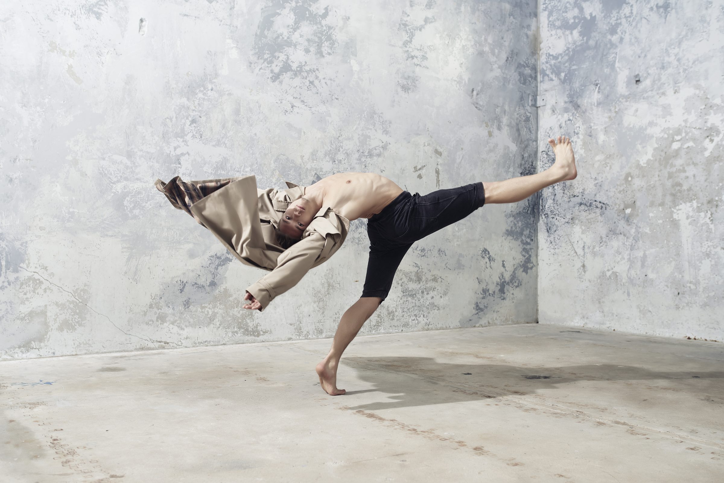Female dancer practicing core and pelvic floor control during dance routine.