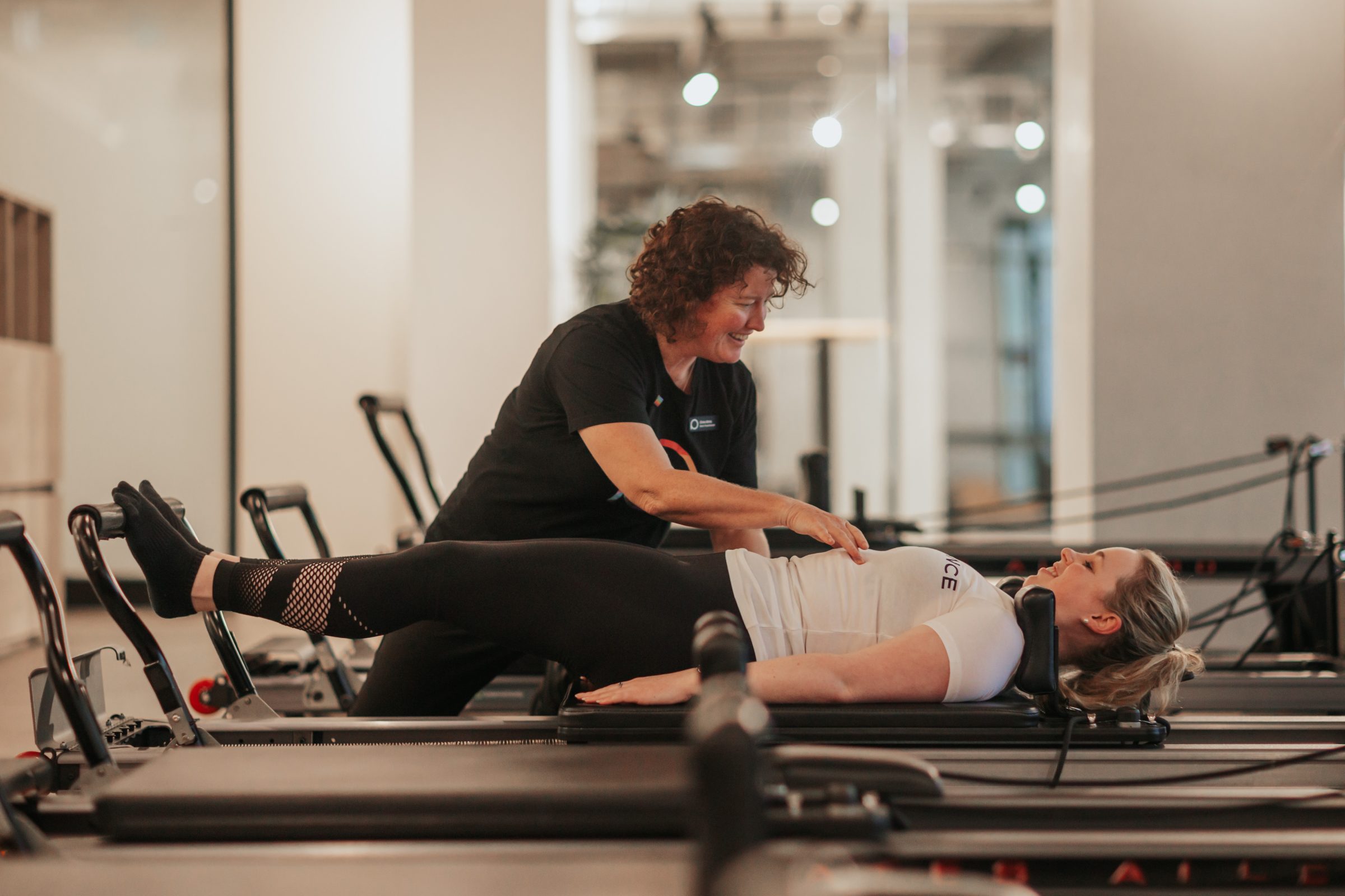 Physiotherapist guiding a client through safe exercise at Performance Medicine clinic to manage Type 2 Diabetes.